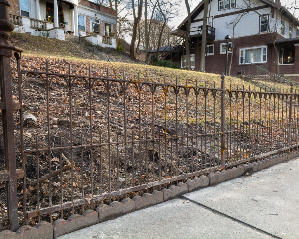 Repaired wrought iron fence historic home restoration